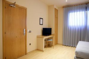 TV a/nebo společenská místnost v ubytování Apartamentos DV