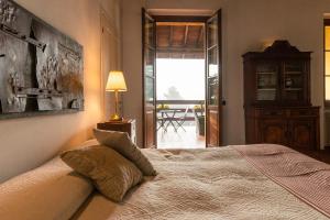 Postel nebo postele na pokoji v ubytování Agriturismo Bassanella
