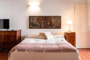 Postel nebo postele na pokoji v ubytování Agriturismo Bassanella