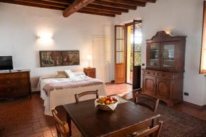 Postel nebo postele na pokoji v ubytování Agriturismo Bassanella