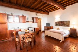 Postel nebo postele na pokoji v ubytování Agriturismo Bassanella