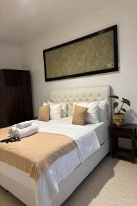 Postel nebo postele na pokoji v ubytování Tendan Residence