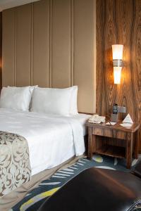 Postel nebo postele na pokoji v ubytování Zenith Hotel Putrajaya + 37 fotografií