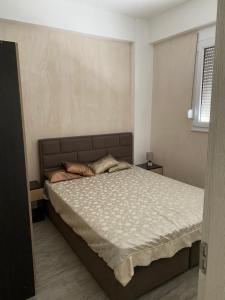 a bedroom with a large bed in a room at Apart Bella Utjeha Sea View 68 qm in Utjeha +3 photos