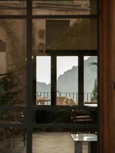 a window looking out at a view of a balcony at Es Petit de Valldemossa in Valldemossa
