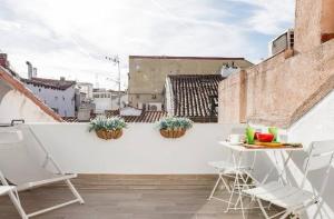 En balkon eller terrasse på Ático duplex con terraza en puro centro, 2 a 8 pax