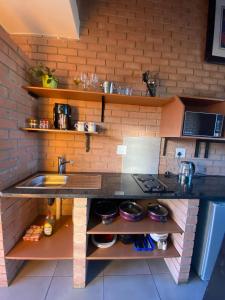 a kitchen with a sink and a counter top at Mordern Lil' Love Nest Loft in Midrand in Midrand