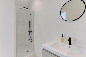 a bathroom with a shower and a sink and a mirror at Maison Joseph - Suite 2 in Saint-Jacques-de-la-Lande +6 photos