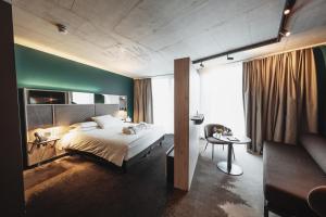 Mercure Hotel Delémont客房内的一张或多张床位