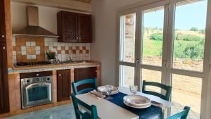 A kitchen or kitchenette at Audaces Resort Még 36 kép