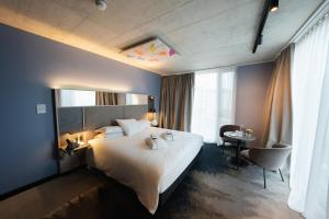 Mercure Hotel Delémont客房内的一张或多张床位