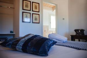 A bed or beds in a room at Audaces Resort