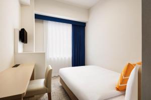 Postel nebo postele na pokoji v ubytování Four Points Flex by Sheraton Morioka