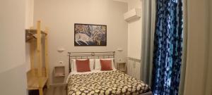 Postel nebo postele na pokoji v ubytování Titi Rooms + 12 fotografií