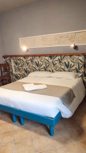 Postel nebo postele na pokoji v ubytování B&B Popoli Terme
