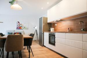 Kuchyň nebo kuchyňský kout v ubytování Duplex Échanges complices ,Frontière