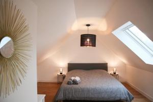 Postel nebo postele na pokoji v ubytování Duplex Échanges complices ,Frontière