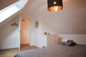 Postel nebo postele na pokoji v ubytování Duplex Échanges complices ,Frontière
