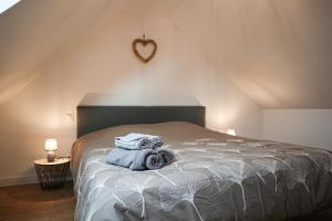 Postel nebo postele na pokoji v ubytování Duplex Échanges complices ,Frontière