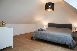 Postel nebo postele na pokoji v ubytování Duplex Échanges complices ,Frontière
