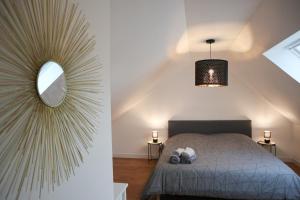 Postel nebo postele na pokoji v ubytování Duplex Échanges complices ,Frontière
