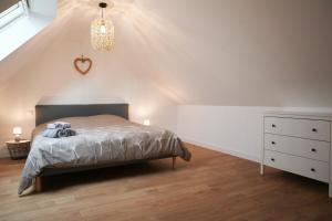 Postel nebo postele na pokoji v ubytování Duplex Échanges complices ,Frontière