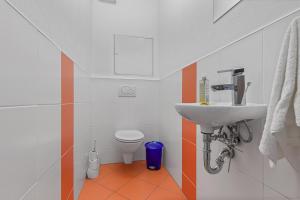 a bathroom with a sink and a toilet at AH Bosakova Elegant in Bratislava +9 photos