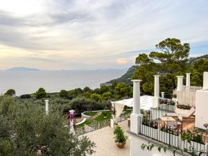 a view of the ocean from the balcony of a house at Amira Resort in Anacapri