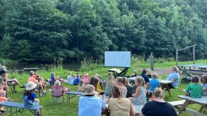 a group of people sitting in chairs watching a presentation at Camp Kyllburg in Kyllburg