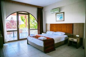 Postel nebo postele na pokoji v ubytování Greenport Bodrum Hotel