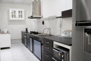 a kitchen with a sink and a counter top at Cozy Homey Place Townhome in Bangkok +17 photos