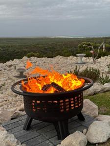 a fire pit sitting on top of a table at Protea32 in Agulhas +7 photos