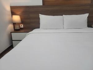 Voodi või voodid majutusasutuse Luxor Boutique Hotel toas