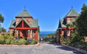 a large brick building with two turrets at Grace at C in Herolds Bay