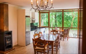 a kitchen and dining room with a table and chairs at Usko in Amurrio