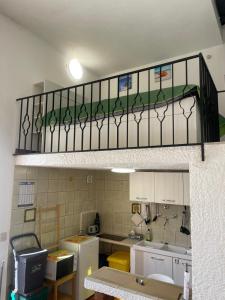 a room with a kitchen with a kitchenasteryasteryasteryasteryasteryasteryasteryastery at nanzi u mare in San Vito lo Capo +5 photos