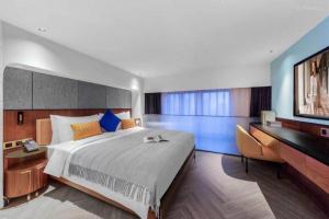 Postel nebo postele na pokoji v ubytování Citadines Gu Bei Shanghai + 18 fotografií