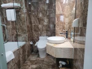 Vannituba majutusasutuses Luxor Boutique Hotel