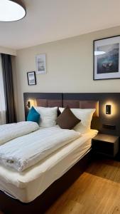 a hotel room with two beds and a large bedvisor at Gasthaus Adler in Dietingen