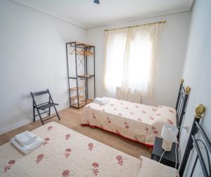 A bed or beds in a room at AT SAN MIGUEL o