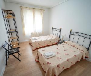 A bed or beds in a room at AT SAN MIGUEL o