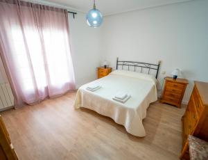 A bed or beds in a room at AT SAN MIGUEL o
