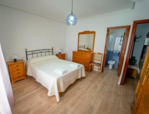A bed or beds in a room at AT SAN MIGUEL o