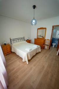 A bed or beds in a room at AT SAN MIGUEL o