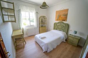 A bed or beds in a room at AT SAN MIGUEL o