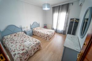 A bed or beds in a room at AT SAN MIGUEL o