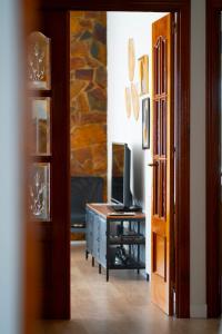 A television and/or entertainment centre at AT SAN MIGUEL o