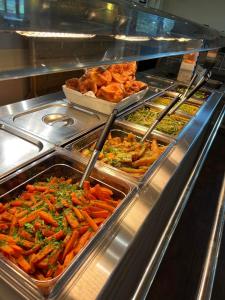 a buffet line with many different types of food at Bowood Park Hotel in Camelford