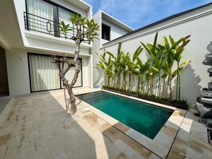 a swimming pool in the courtyard of a house at Lipah Beach Private Villas in Amed +32 photos