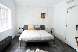 Postel nebo postele na pokoji v ubytování Boetiekhotel Villa Wanrooy